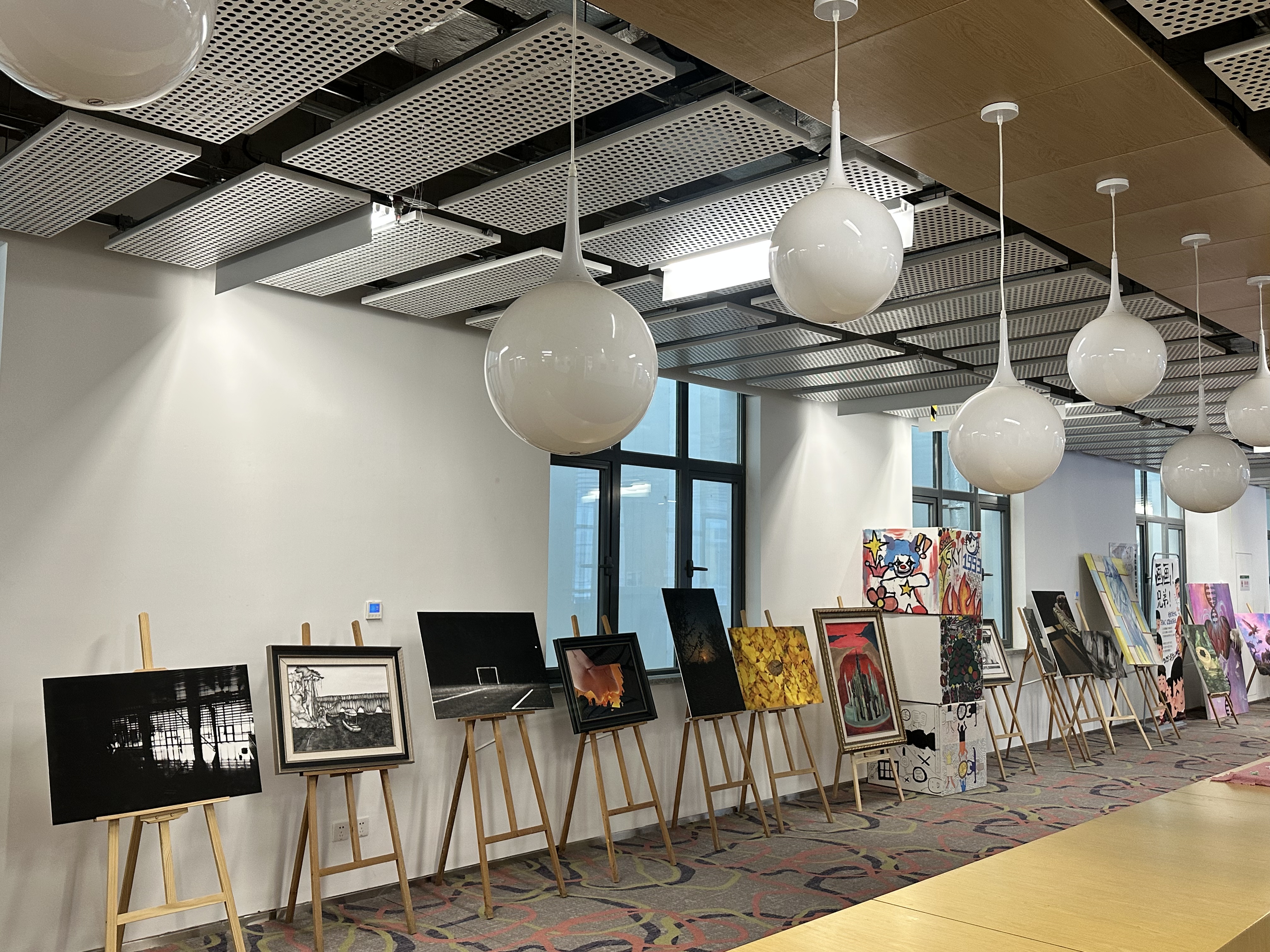 Student artwork on display in a gallery-style setting